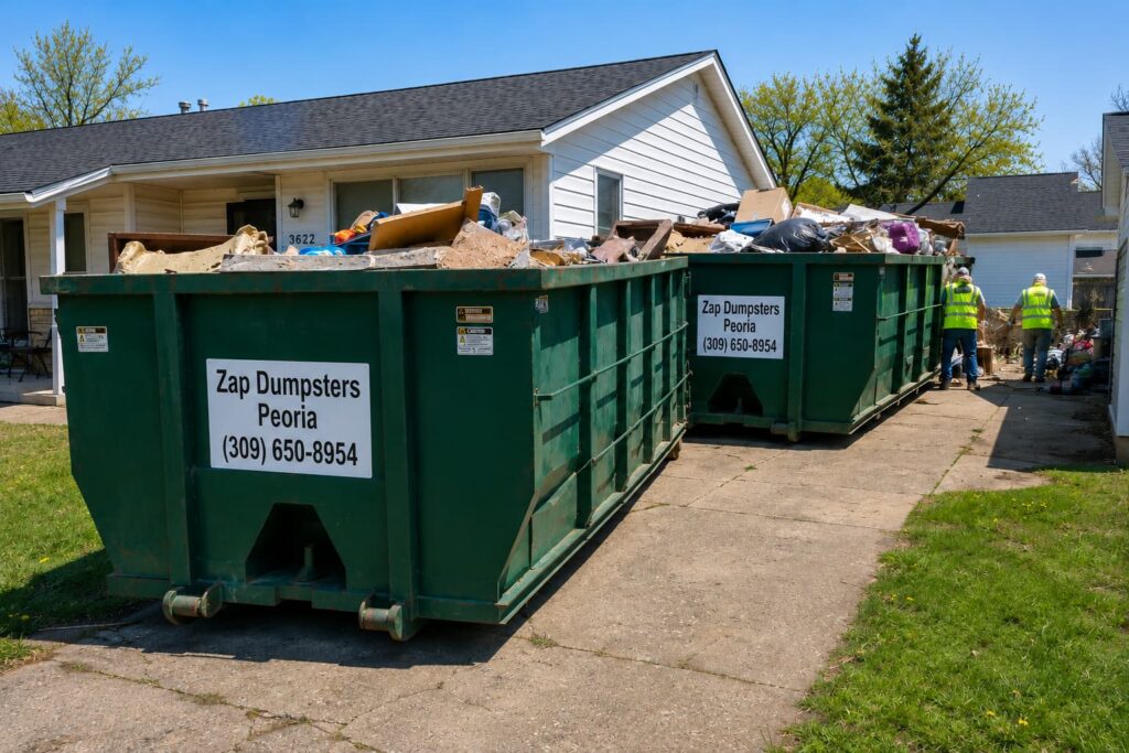 Large roll-off dumpsters used for cleaning up after hoarder tenants at a Peoria Illinois rental property