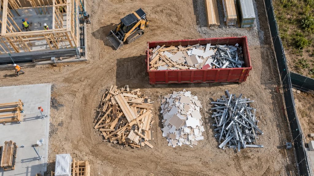 sorted job site debris ready for monitored disposal using construction waste tracking apps